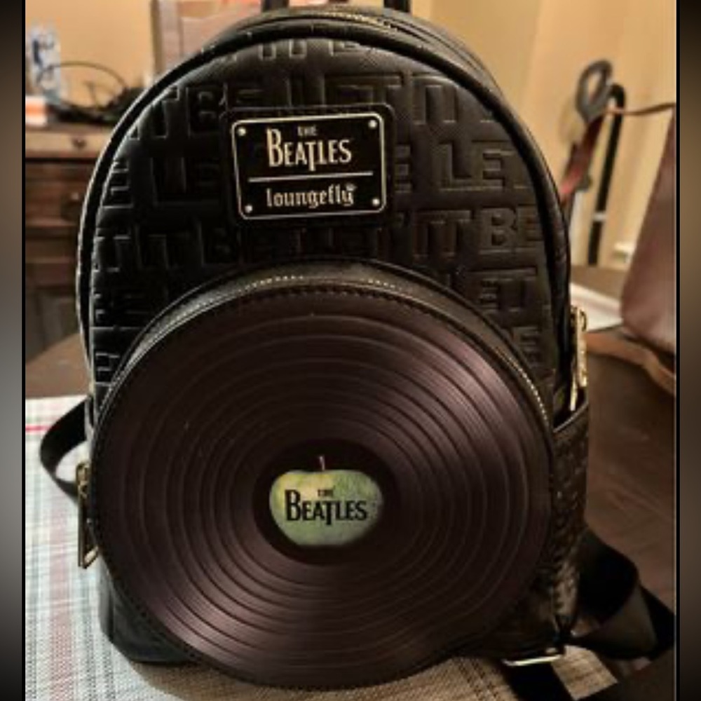 Loungefly Beatles back pack.  Beautiful   Used once   Brand new condition